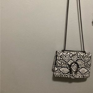 Snake skin handbag with gun metal hardware